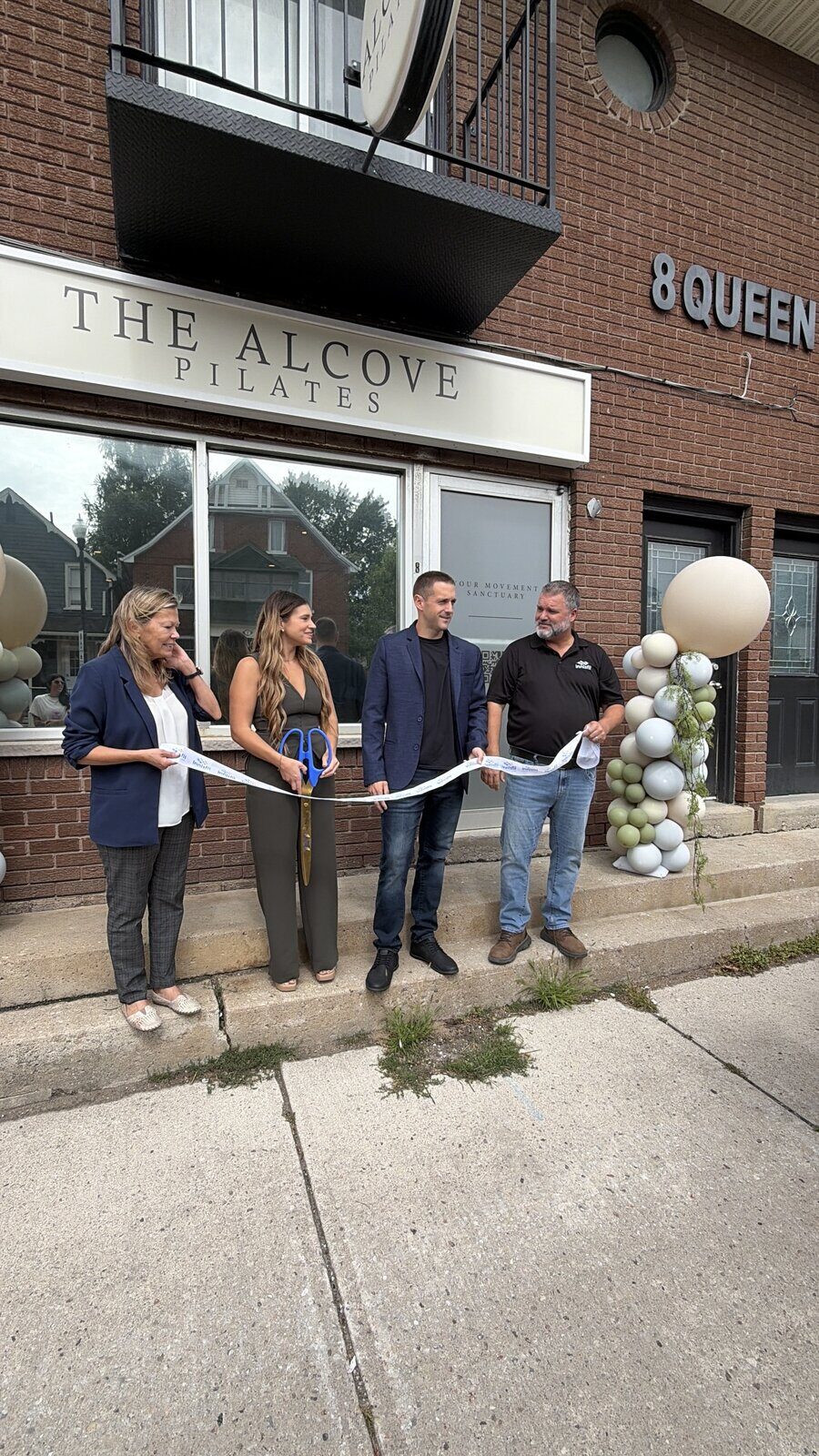 Ribbon cutting outside The Alcove on Queen Street in Cookstown