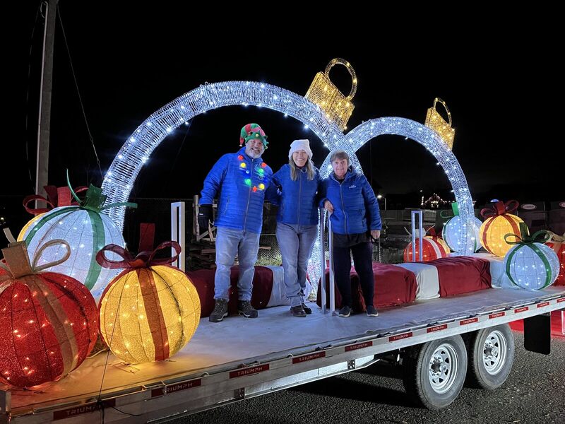 Fred Drodge on a lit holiday parade float at night